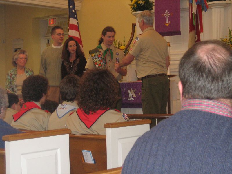 Eagle Scout Edgett (shown with family) is installed